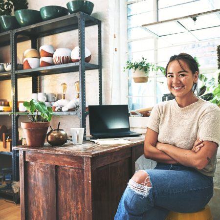 Asian woman, portrait and ceramic artist with pottery for small business startup at eco friendly store. Happy, female person or environmentalist with smile for clay design or creations at workshop.